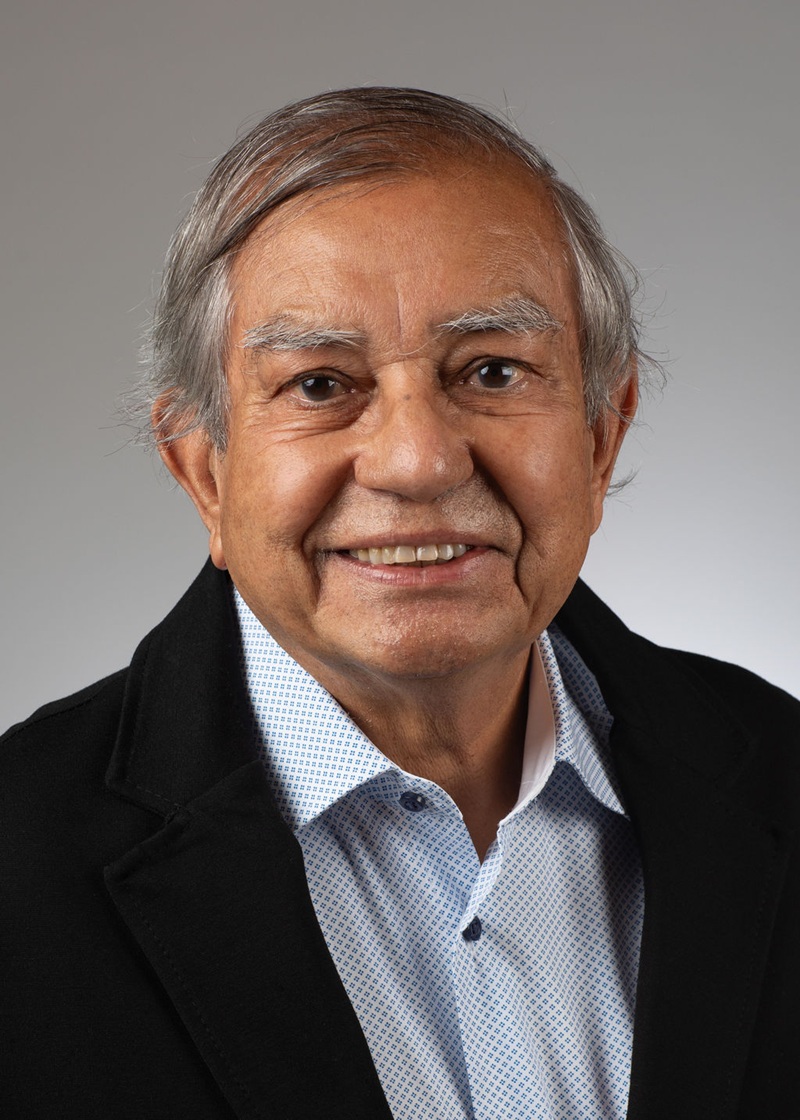 man standing near white wall