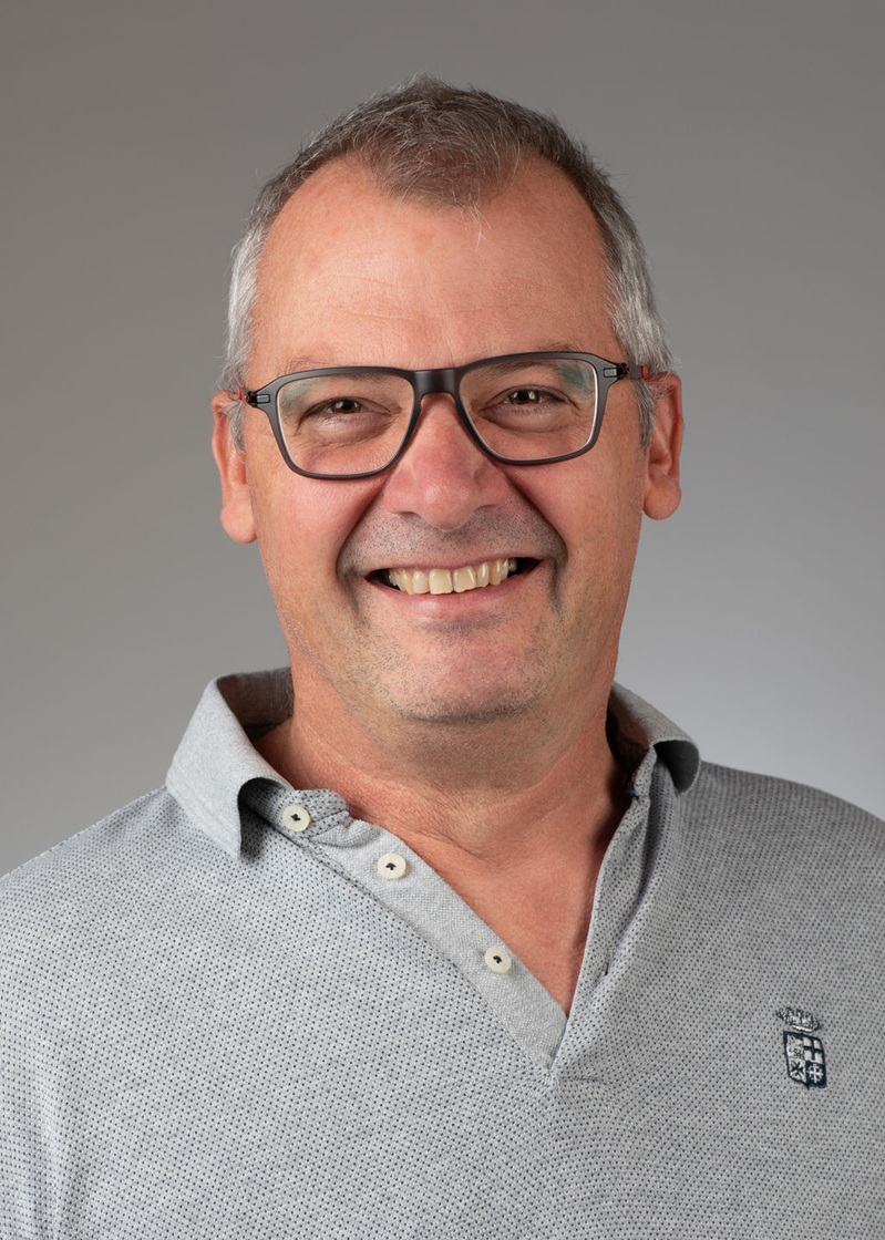 man standing near white wall