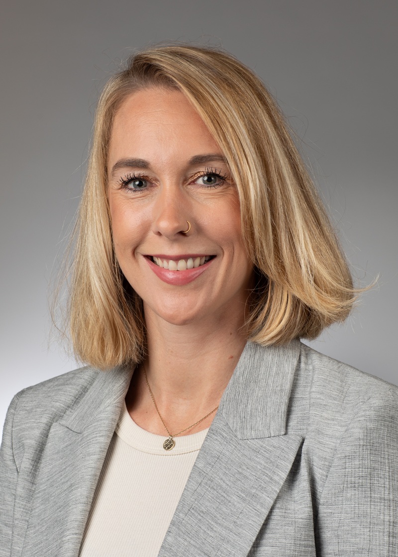man standing near white wall