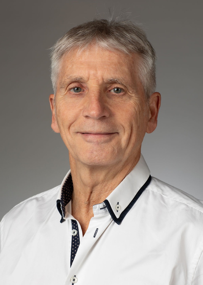 man standing near white wall