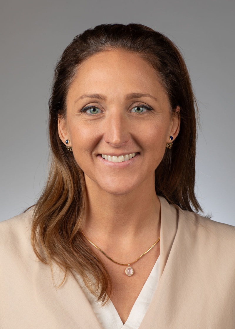 man standing near white wall