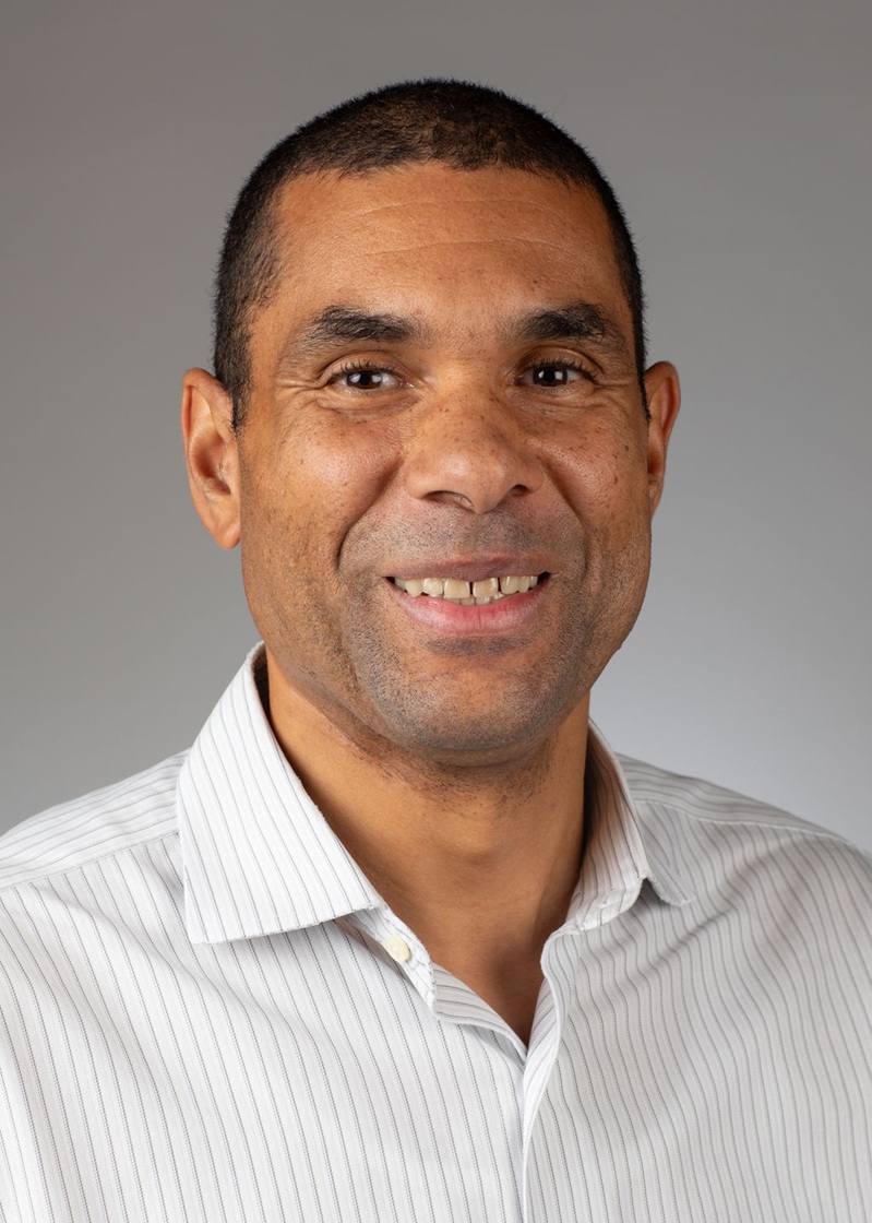 man standing near white wall